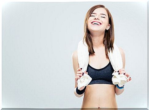 Woman-happy-after-exercises-white-towel-on-shoulders