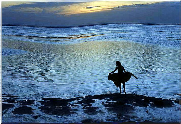 woman facing the sea