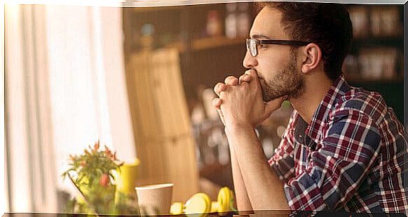 Man with glasses thinking