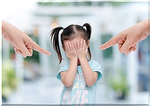 little girl being scolded by her parents