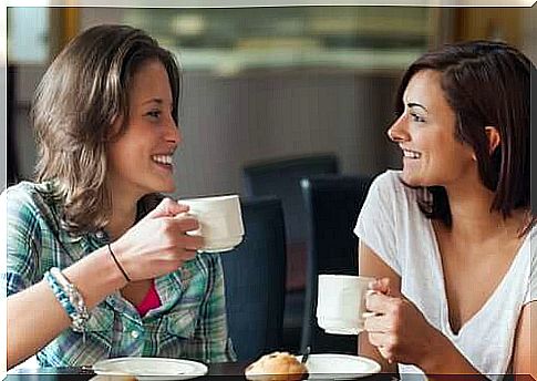 Two friends drinking coffee 